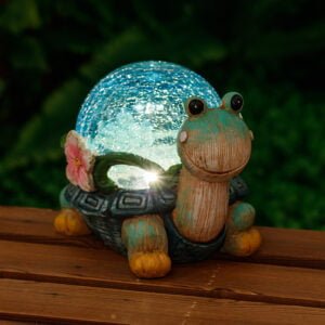 Garden turtle with cracked glass ball