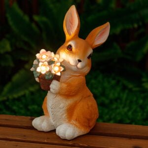 Garden rabbit holding a flower pot with glowing flowers on it